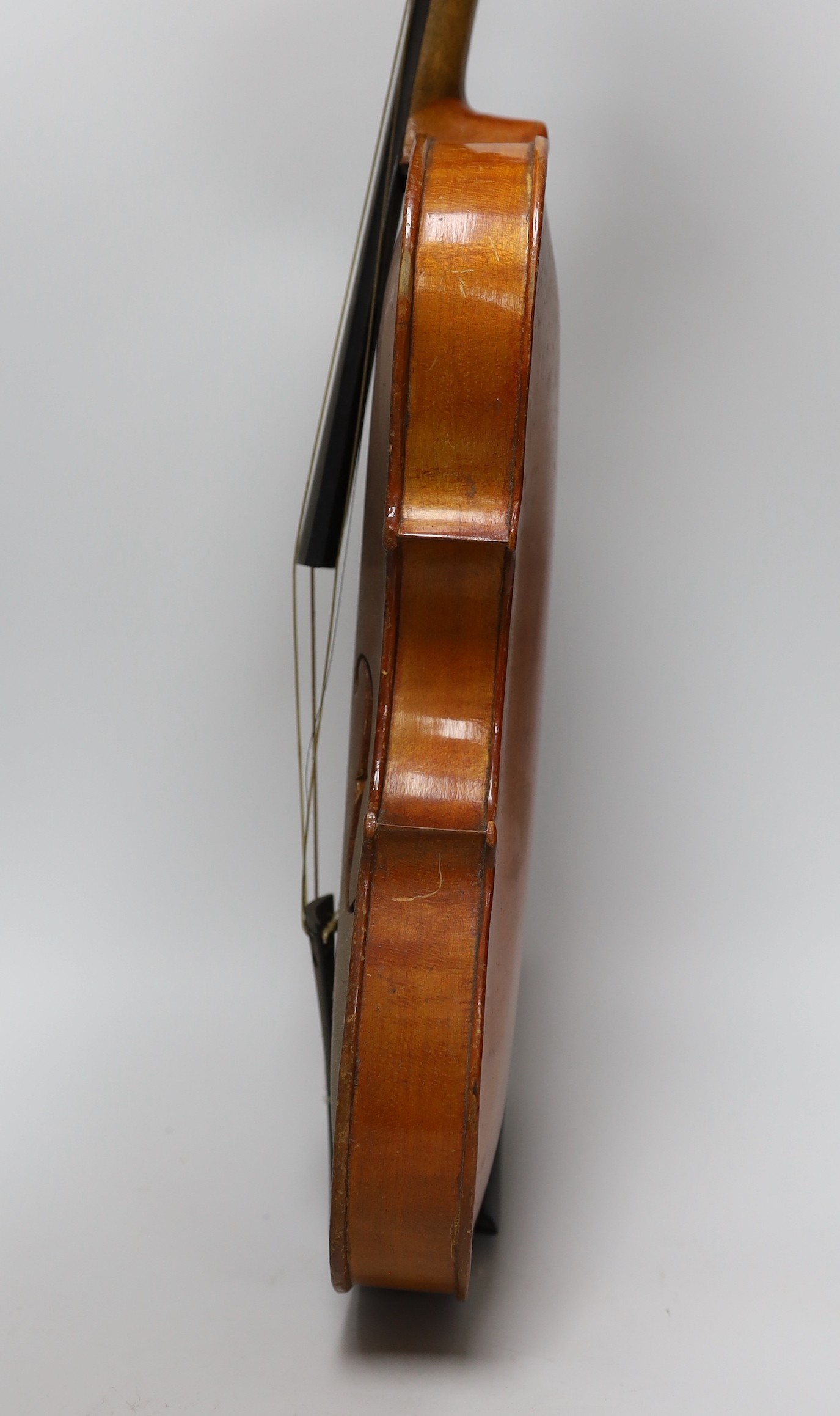 An early 20th century Stainer violin, patent number 23140, back measures 36.5cm excl button. cased